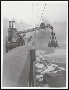 Smashing ice at Chelmsford Ral Bridge RT4 Billerica