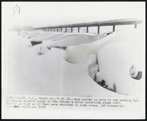 Newark, N.J. - NO Go - Cars buried in snow at the parking lot at Newark Airport today in New Jersey's worst snowstorm since 1947. Drifts as high as 12 feet were reported in some areas.