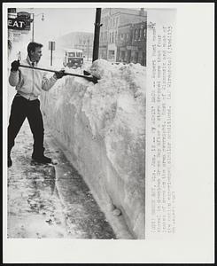 Green Bay, Wis. - My Achin' Back - Robert Hunt mans a shovel in downtown Green Bay after a storm dropped more than four inches of snow on the area overnight. Most of Wisconsin and much of the nation experienced similar conditions.