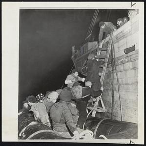 Up The Ladder to two-masted schooner go the immigrants with all their worldly possessions strapped on their backs or slung over their shoulders.
