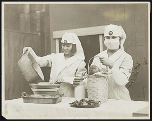 Putting up food for sufferers.
