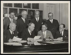 Members of the state board of housing and Dwight L. Hoopingarner, associate director of the federal housing administration, in conference yesterday with Mayor Mansfield at City Hall. Left to right, standing, Charles N. Norton, J. Fred Becket, Sidney T. Strickland and John Carroll. Seated, left to right, Fred J. Lucey, Mayor Mansfield, Dwight L. Hoopingarner and Henry J. Ryan.