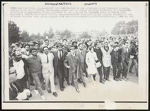 Reject Concessions-- Led by San Francisco Black Community leaders, demonstrating State College dissidents, march off the campus shouting rejection of concessions offered by S.I. Hayakawa, acting president to end a strike by minority group students. This included a full-fledged Black studies Department. Fifth from left is Dr. Carlton Goodlet who was arrested Thursday when police clashed with demonstrators.