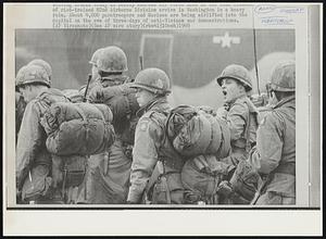 Of riot-trained 82nd Airborne Division arrive in Washington in a heavy rain. About 4,000 paratroopers and Marines are being airlifted into the capital on the eve of three-days of anti-Vietnam war demonstrations.