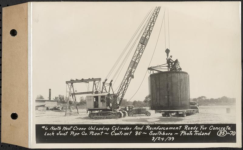 Contract No. 85, Manufacture and Delivery of Precast Concrete Steel Cylinder Pipe, Southborough, Framingham, Wayland, Natick, Weston, #6 northwest crane unloading cylinder and reinforcement ready for concrete, Southborough, Mass., Aug. 24, 1939