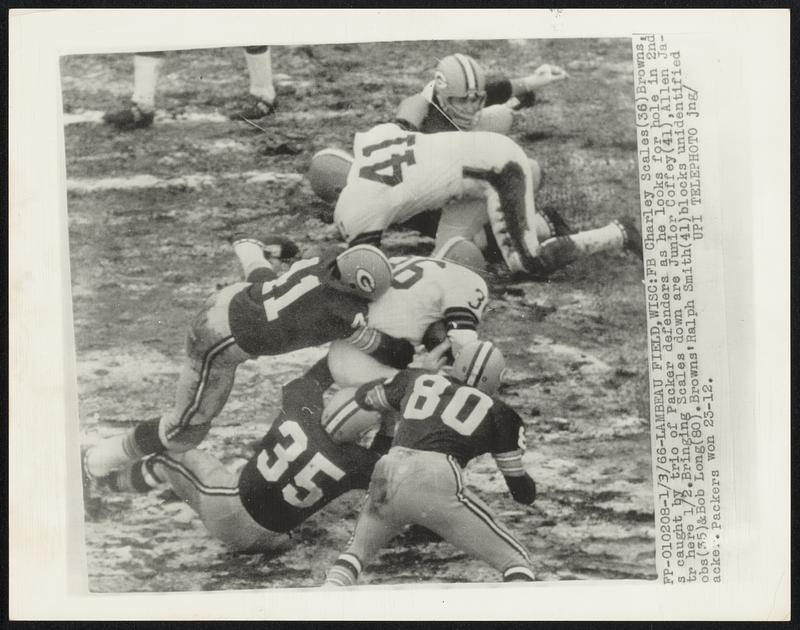 Lambeau Field, Wisc- FB Charley Scales (36) Browns, [i]s caught by trio of Packer defenders as he looks for hole in 2nd [q]tr here 1/2. Bringing Scales down are Junior Coffey (41), Allen Ja[c]obs (35) & Bob Long (80). Browns' Ralph Smith (41) blocks unidentified [P]acker. Packers won 23-12.