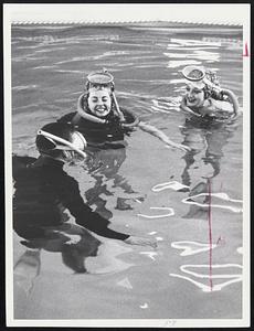 Frank Scalli, left Betty Porter, ctr. Elaine Karroll, right in pool at Aqua Sports Ctr, Natick Scalli gives last minute instructions to his pupils before submerging. He has underwater sound system that permits him to speak to girls while he is underwater or while they are - or both.