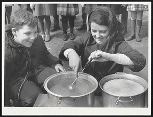 City Children making maple syrup are delighted by the experience of boiling down the sap from trees in far away Vermont. The treat took place at John A. Andrew School, South Boston, with fifth graders Patrick Nee and Mary McDonald tasting the delicious concoction.