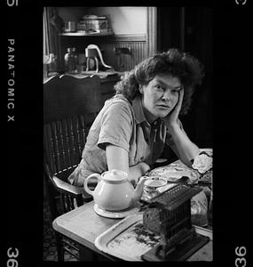 Unidentified woman at kitchen table