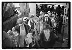 Passengers getting on a ship