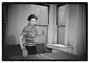A woman playing table tennis