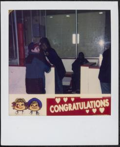 Children standing by the ice rink door
