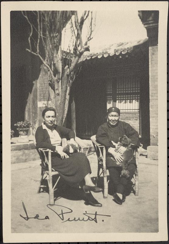 Ida Pruitt sitting with woman and two dogs