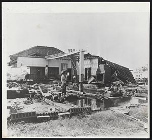 Hurricane Ione causes the cancelling of a dance at the American Legion club in New Bern, N.C. She blew the building down (upper photo). Below, church in Tampico, Mexico, houses some of the 20,000 refugees who were driven from their homes by Hurricane Hilda.