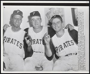 Beat the Phillies in the 11th Inning -- Bob Poterfield, sitting between R.C. Stevens (left) and Dick Groat (right) grins in the dressing room after he had won his first start in the National League, beating Philadelphia 1 to 0 in 11 inning. Stevens singled in Groat with the winning run. Pittsburgh also won the first game 10 to 4.