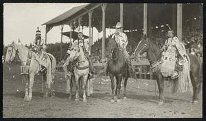 Redskin Beauties at the Pendleton Round-Up The Most Beautiful Indian Girls in America Were Selected from the Tribes Encamped at Pendleton, Ore., During the Annual Round-Up. Dressed in Their Native Costumes, They Presented a Colorful Picture as They Paraded Before Admiring Crowds. Photo Shows, from Left to Right: Blue Meadow, Esther Motanic, Chauncey Bishop, Director of the Indians During the Round-Up, and Minnie Petwa.