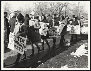 Booted brigade of women teachers in Woburn lends support to school strike.