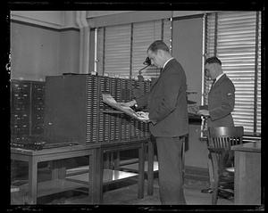 Two men looking through photographs