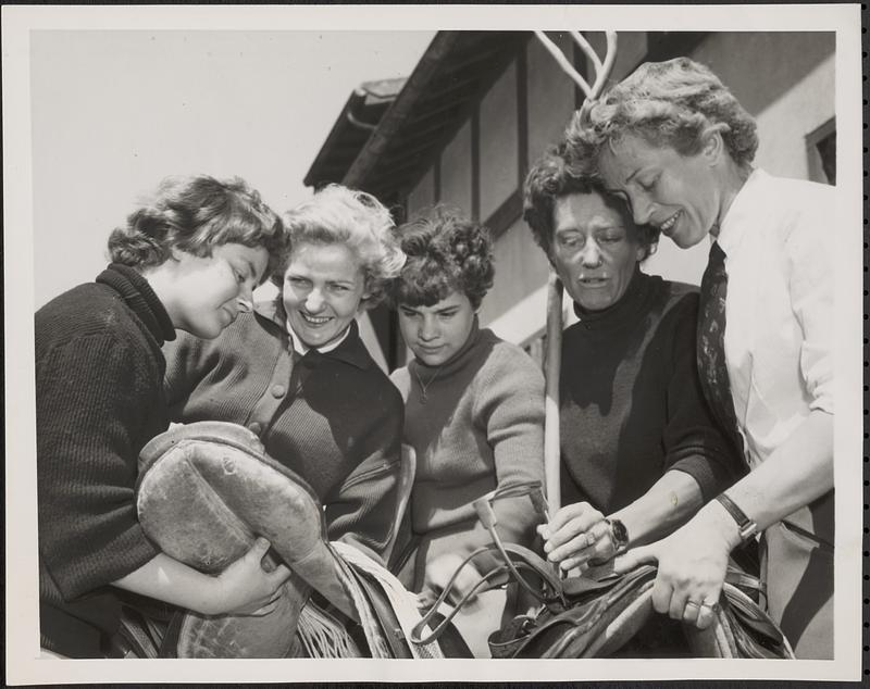 Five of the girl jockeys check their gear