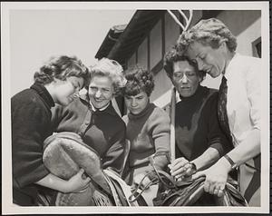 Five of the girl jockeys check their gear