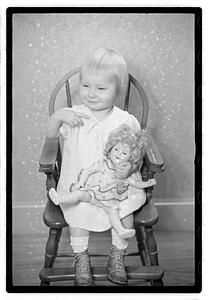 A girl holding a doll