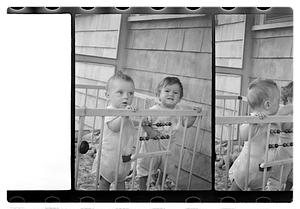 Two children in a playpen