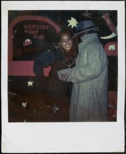 Two young people dressed up and posing