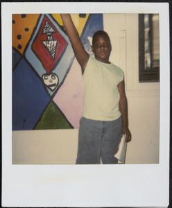 Posing in front of wall mural