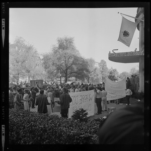 Protesters gathered with signs outside of the Somerset Hotel