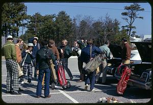 Golfers in parking lot
