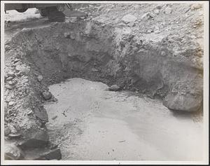 Trench pit 4 showing large rocks, gravel and sandy area