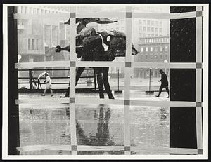 Inside JFK Bldg windows taped