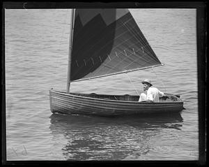 A man in a sailboat