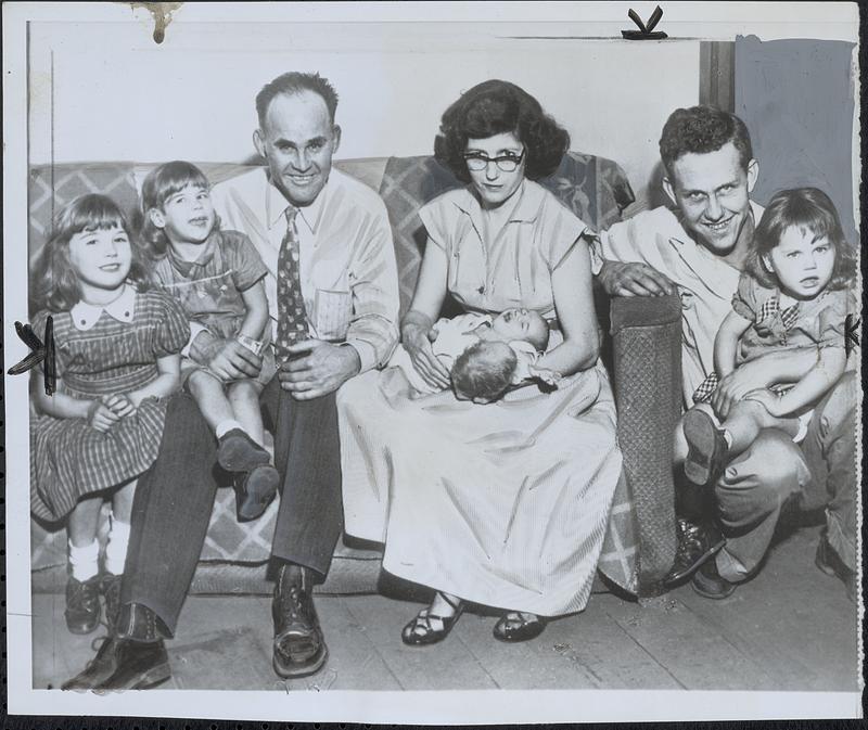 Two-headed baby meets family