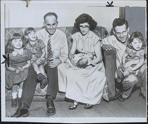 Two-headed baby meets family