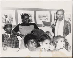 Group of young and older people listening to presentation