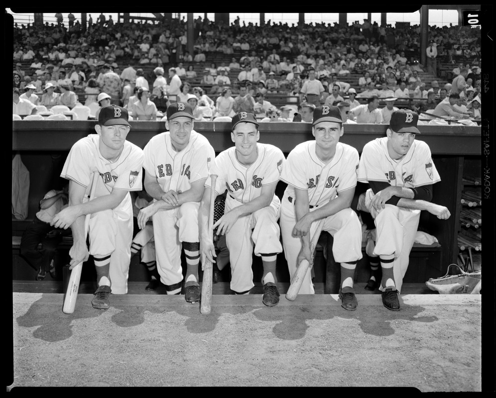 Red Sox players pose in dugout
