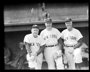 Yankees manager Casey Stengel and coach Jim Turner with player
