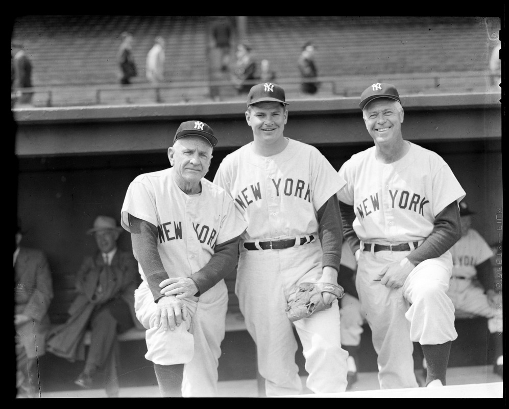 Yankees manager Casey Stengel and coach Jim Turner with player