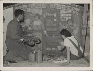 Elizabeth Tracy and Arthur Willis Oakman working on the portion of their mural on printing in the Cambridge Public Library