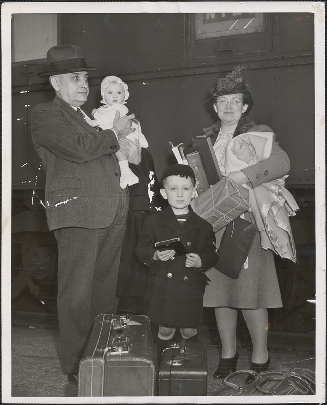 Mayor John Lyon of Cambridge, Mass. with Mrs. Lyon and their two children, baby Ellen and son Leo, are shown on arrival here this afternoon on the Florida East Coast R.R. "Florida Special"