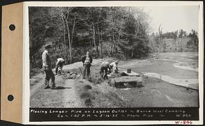 Barre Wool Combing Co. Ltd., showing men placing longer pipe on lagoon outlet, Barre, Mass., 1:05 PM, May 16, 1935