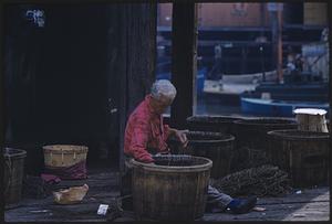 Man working with barrel
