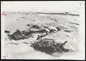 Victim Of Italian dam disaster lies in the mud of what was the village of Longarone. The village was washed away as its people slept, by a torrent of water caused by avalanche of earth.