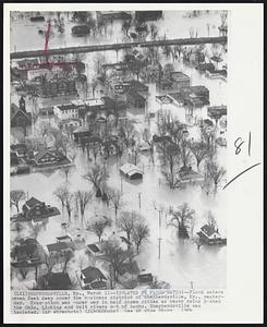 Isolated by Flood Waters--Flood waters seven feet deep cover the business district of Shepherdsville, Ky., yesterday. Evacuation was under way in half dozen cities as heavy rains pushed the Ohio, Licking and Salt rivers out of banks. Shephersville was isolated.