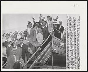 Ready for the Yankees--Manager Fred Haney and his probable starting lineup in opener of World Series against New York Yankees Wednesday line up on plane ramp as the Milwaukee Braves arrive today at Idlewild airport. From front they are: Haney, second baseman, Red Schoendienst, shortstop Johnny Logan, third baseman Eddie Mathews, centerfielder Hank Aaron, first baseman Joe Adcock, outfielders Andy Pafko, Wes Covington and Bob Hazle, catcher Del Rice and pitcher Warren Spahn. Rice holds Ann McMahon, 22-month-old daughter of pitcher Don McMahon. Haney is undecided as yet about starting Hazle.