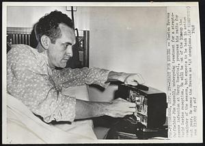 Ready for Series -- Boston Braves outfielder Jim Russell, undergoing treatment for a streptococcus infection at Mercy Hospital, prepares his radio for World Series reception. He will be out of the lineup the remainder of the season, but expects to be back in action next year. He names the Braves as '48 champions.