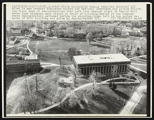 Kent State University campus remained deserted 5/5 after it was ordered evacuated except for National Guardsmen and police following three days of demonstrations that left four dead. At right is Taylor Hall where four students were felled in front of building. Behind is the commons where demonstrators gathered before the shooting. Upper left is the gutted remains of ROTC building set afire by demonstrators.