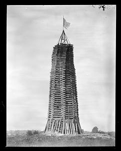 A wooden structure, probably a bonfire pyre
