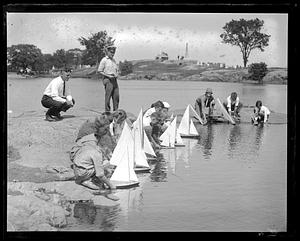 Children sailing toy boats